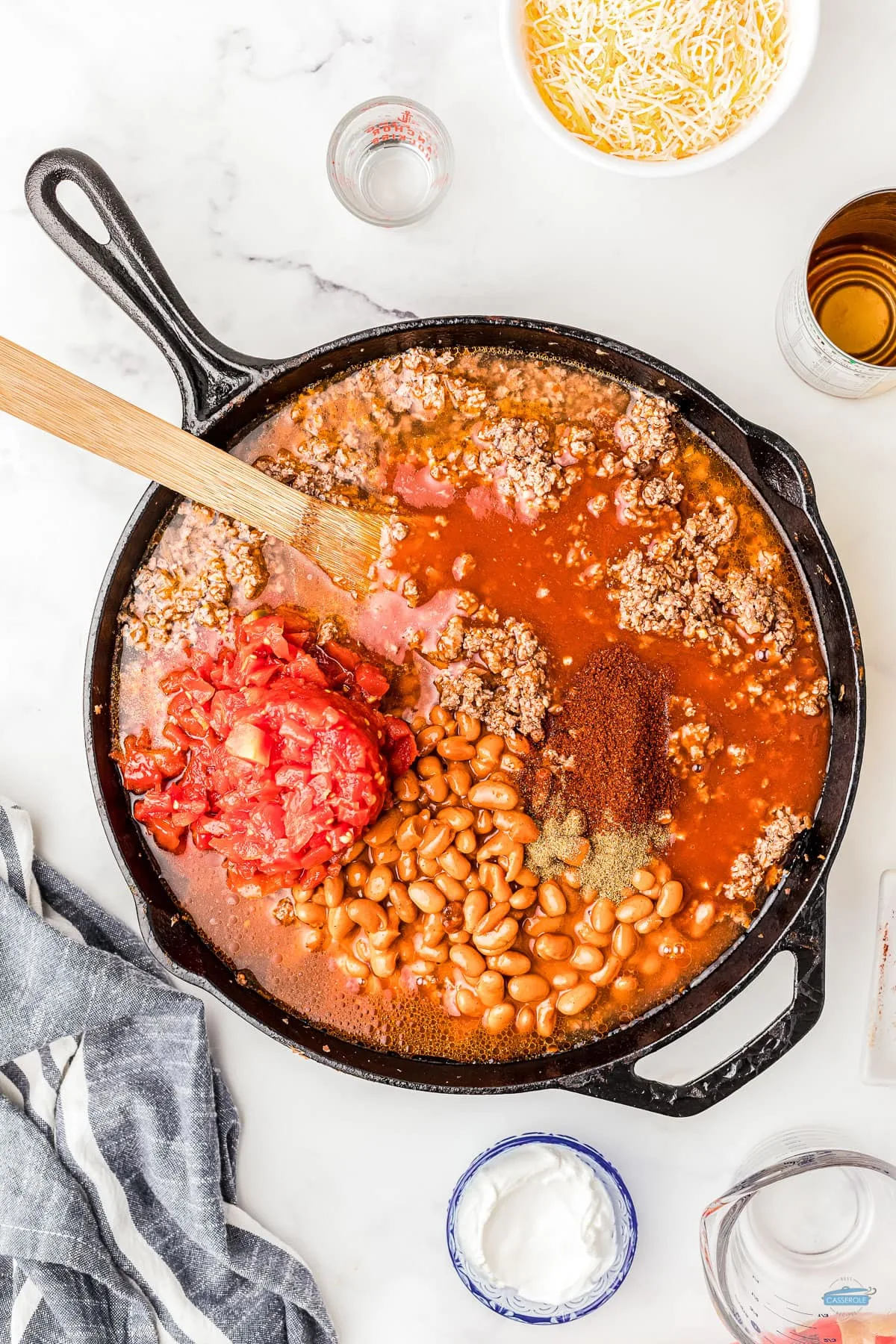 beef mixed with tomatoes and beans in a skillet