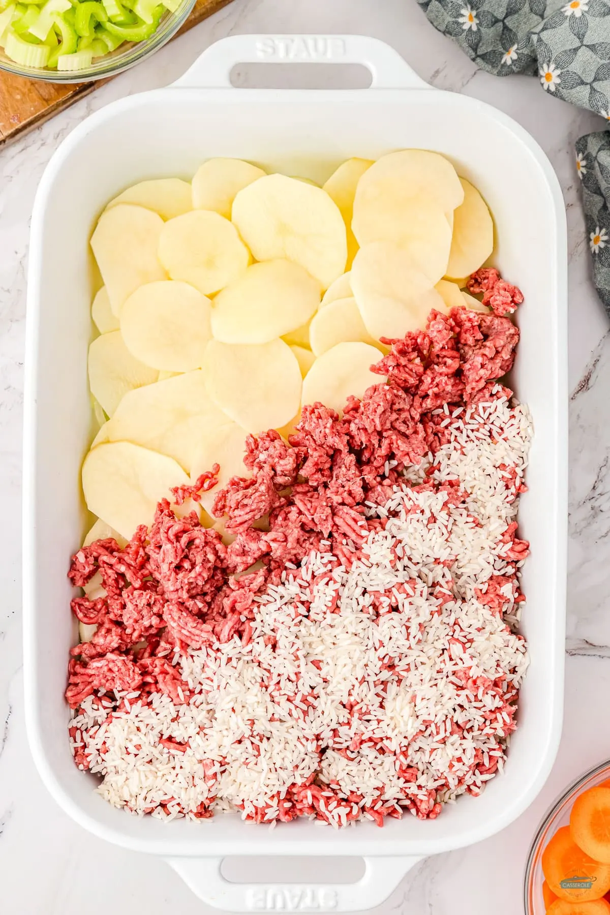 rice layered on beef and potatoes