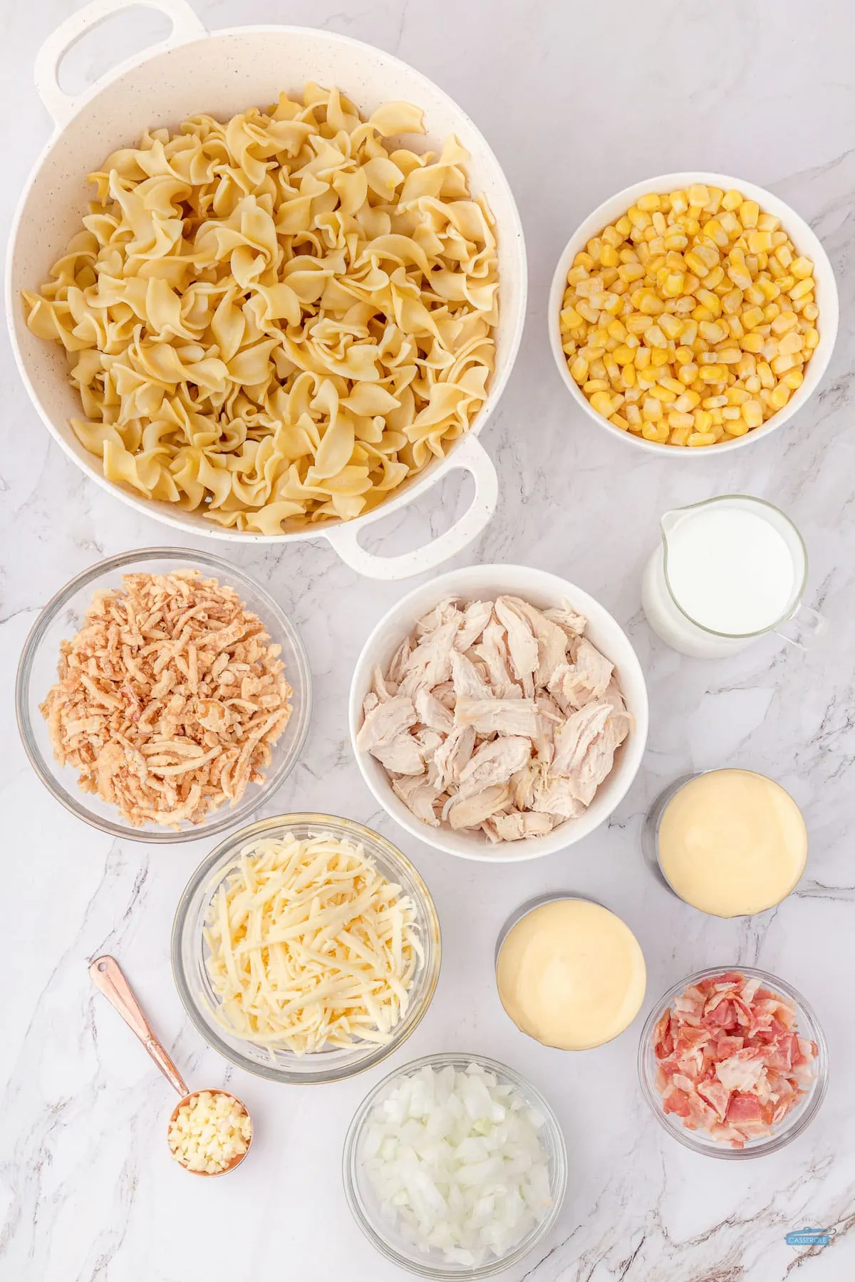 ultimate chicken casserole ingredients in individual bowls