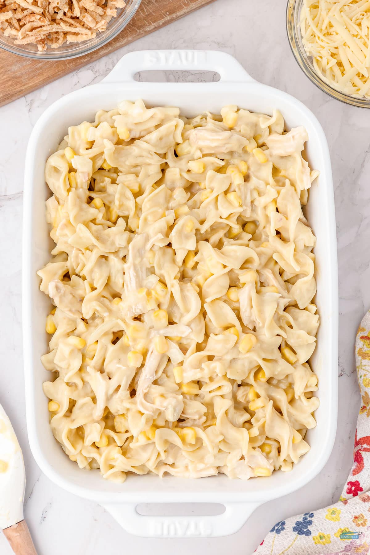 egg noodles and chicken in a casserole dish