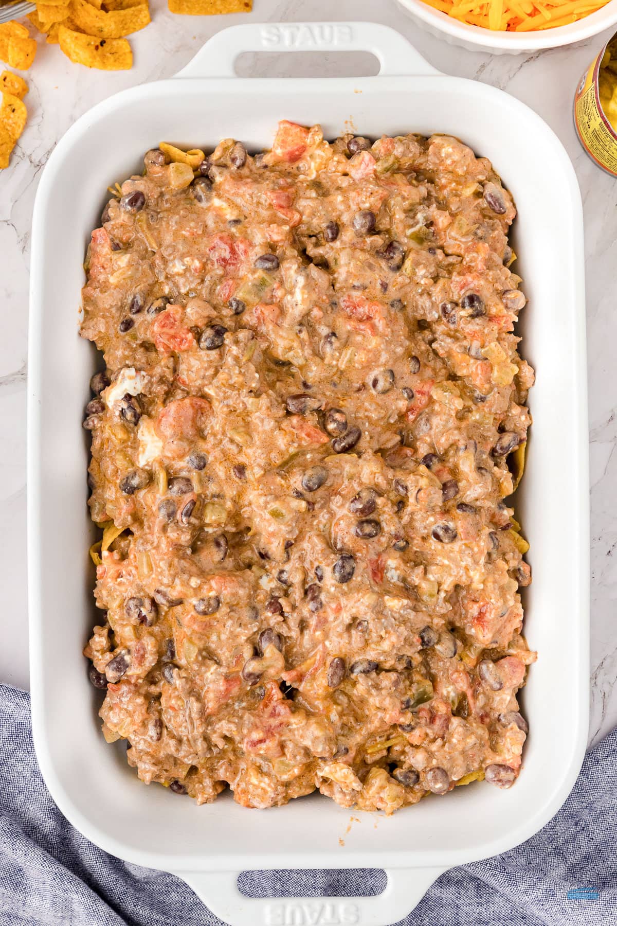 unbaked casserole in a white dish