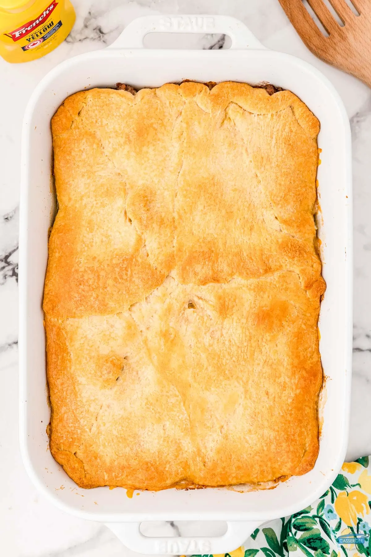 baked bierock casserole in a white dish with a floral napkin on the right