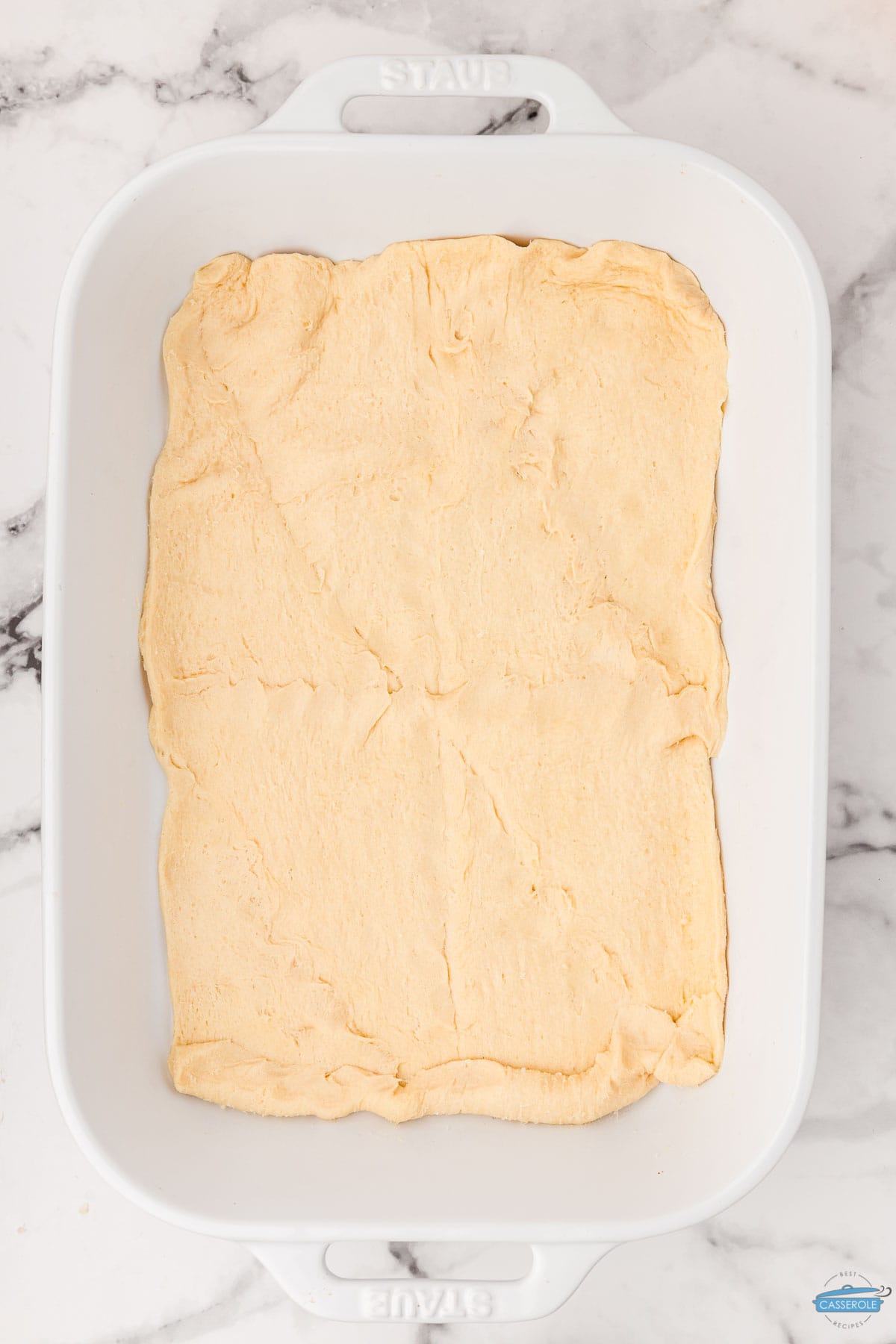 crescent rolls in a white baking dish