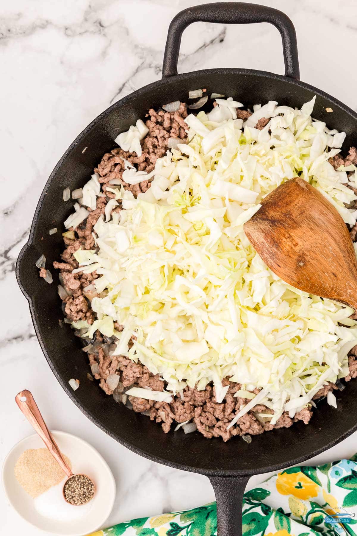 ground beef and cabbage in a cast iron skillet