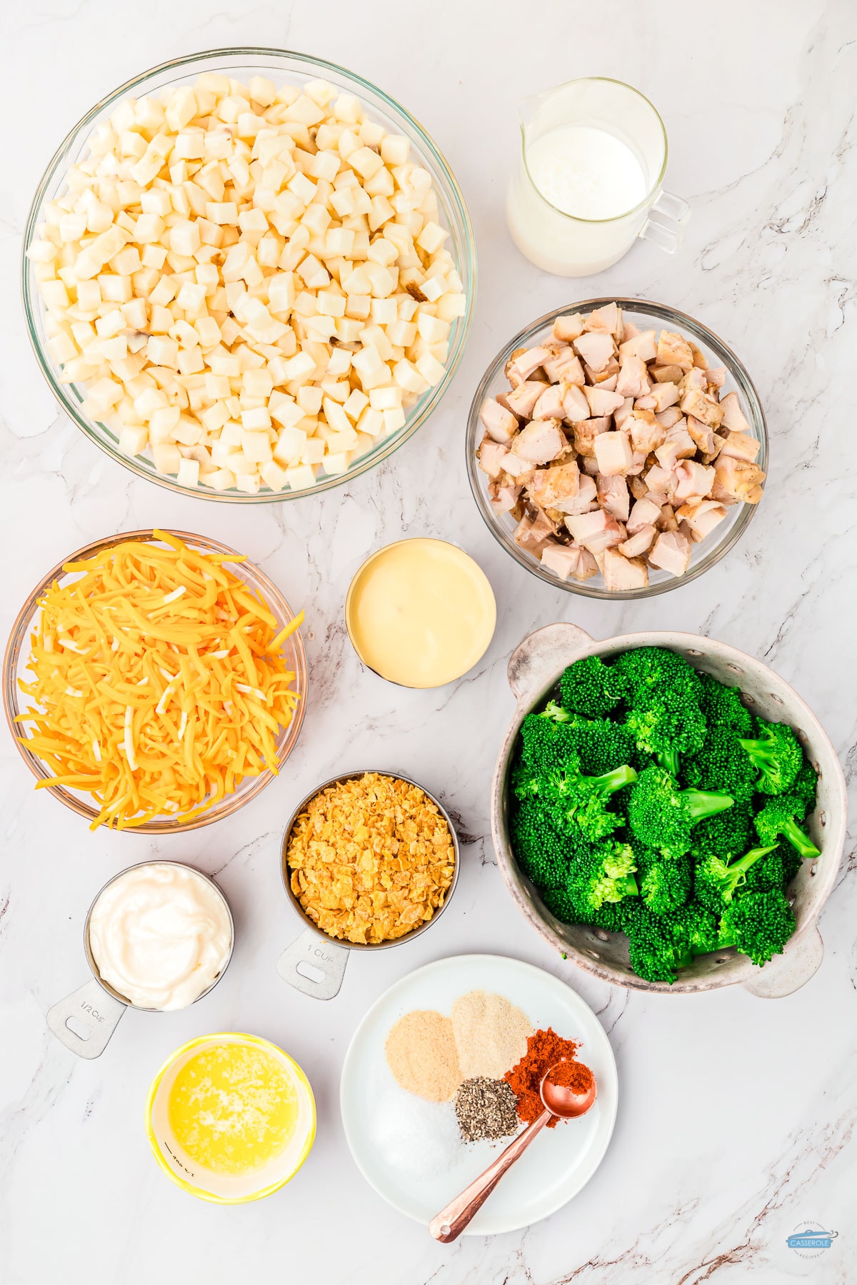ingredients for chicken and potatoes casserole in individual bowls