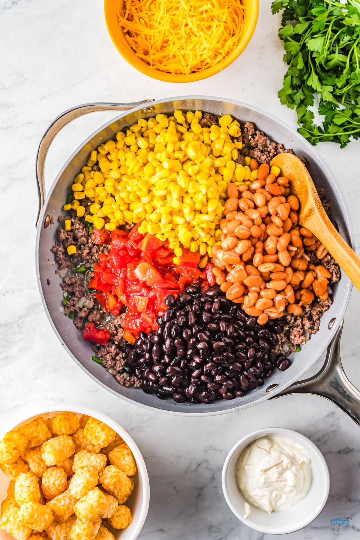 skillet with beans, corn, and tomatoes