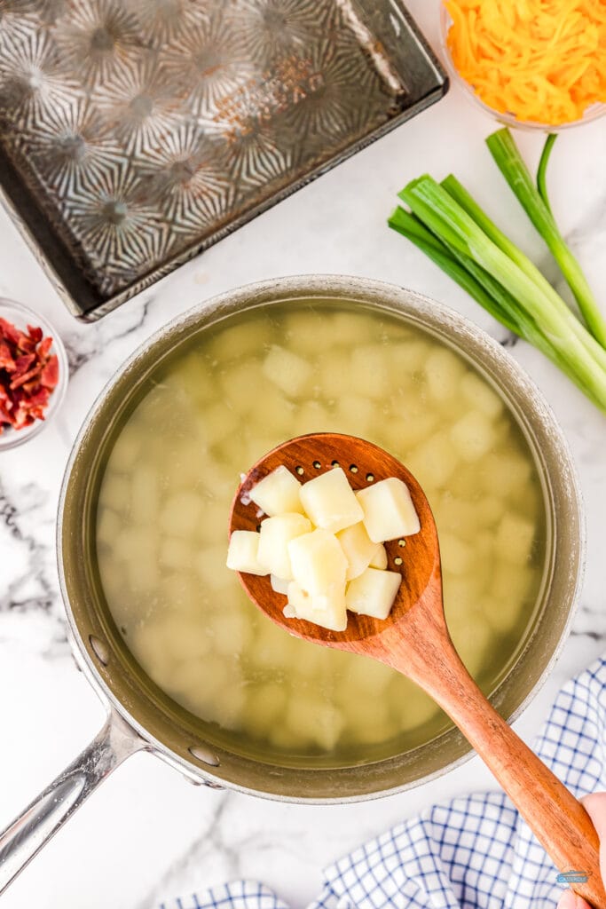 diced potatoes cooking in a pot