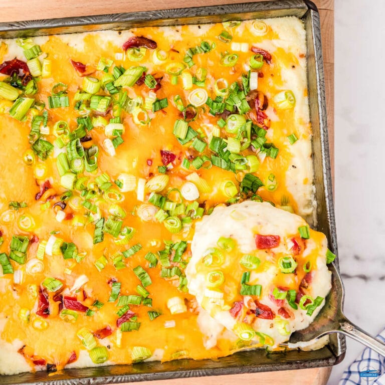 mashed potatoes with cheese and a spoon