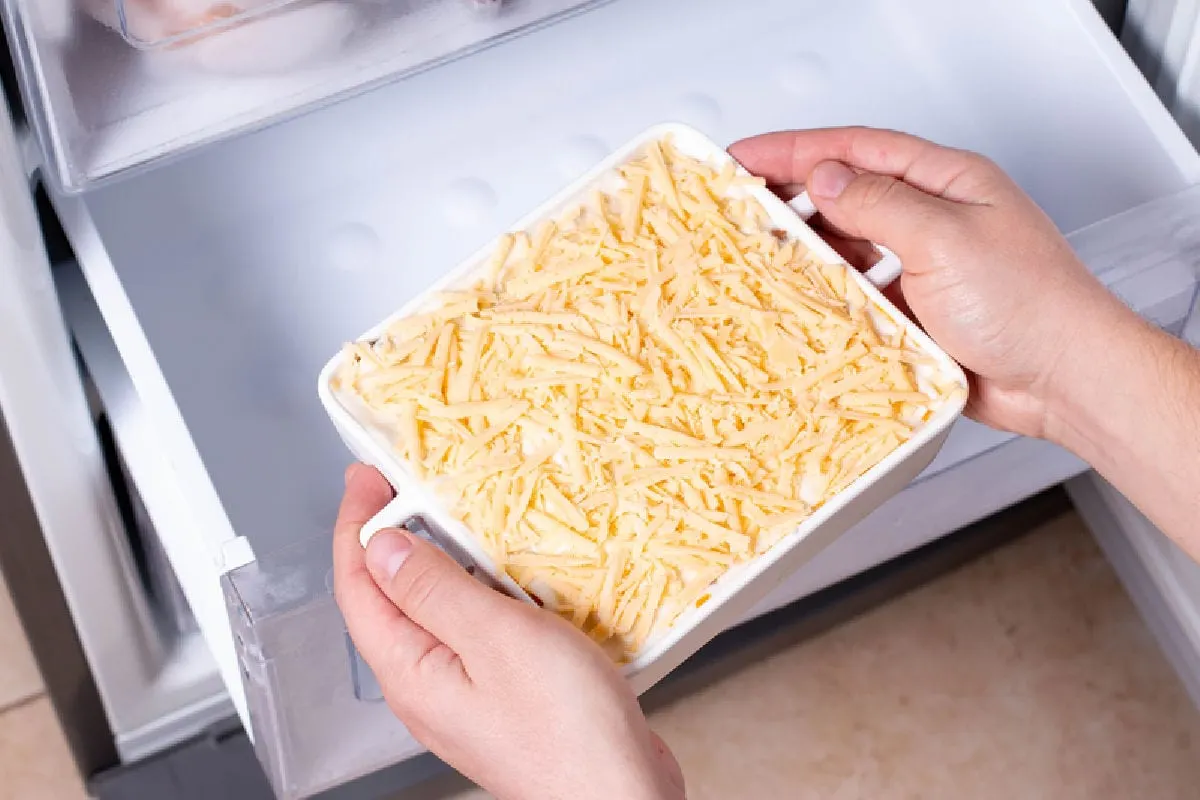preparing a casserole for storing in the fridge