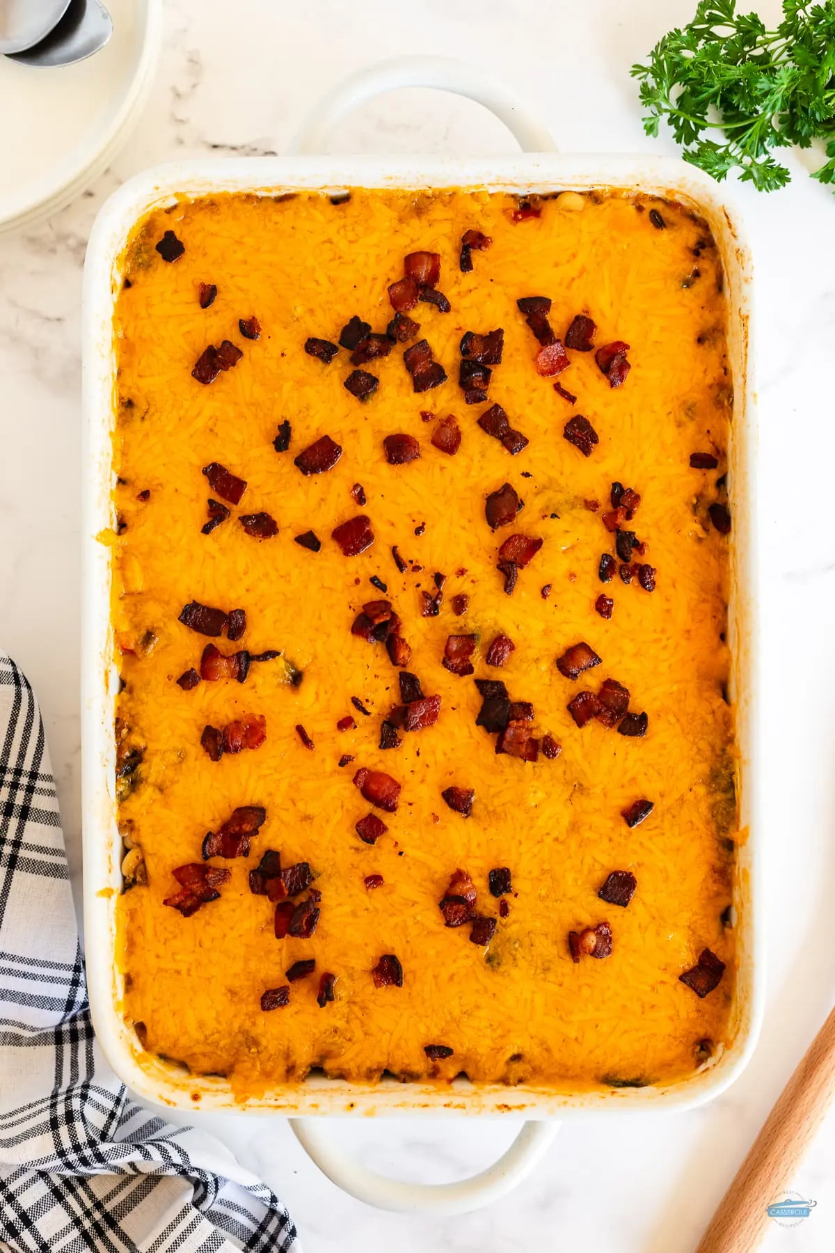 baked black eyed pea casserole with cheese and topped with chopped bacon