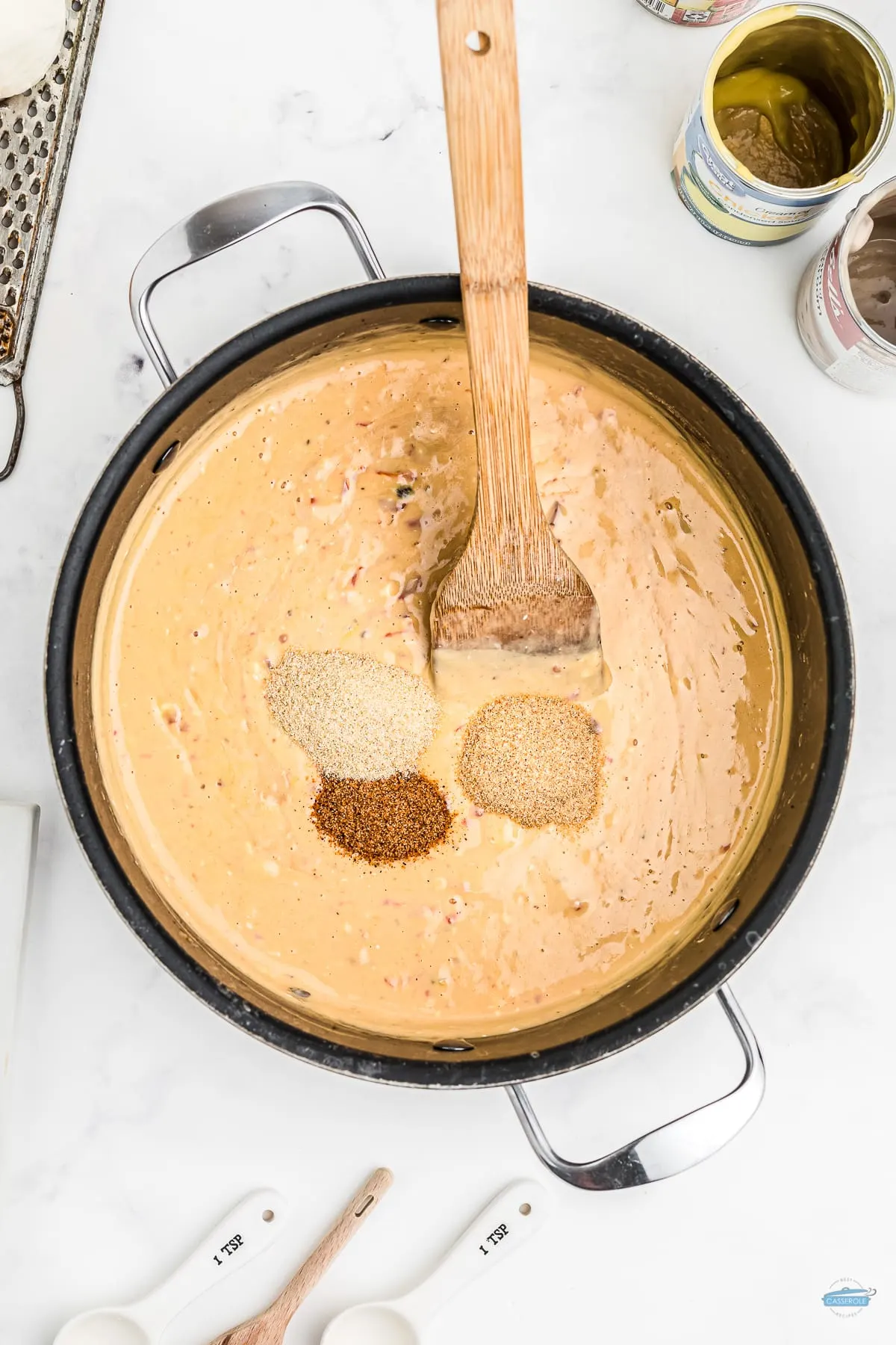 pot of cheese sauce with spices on it