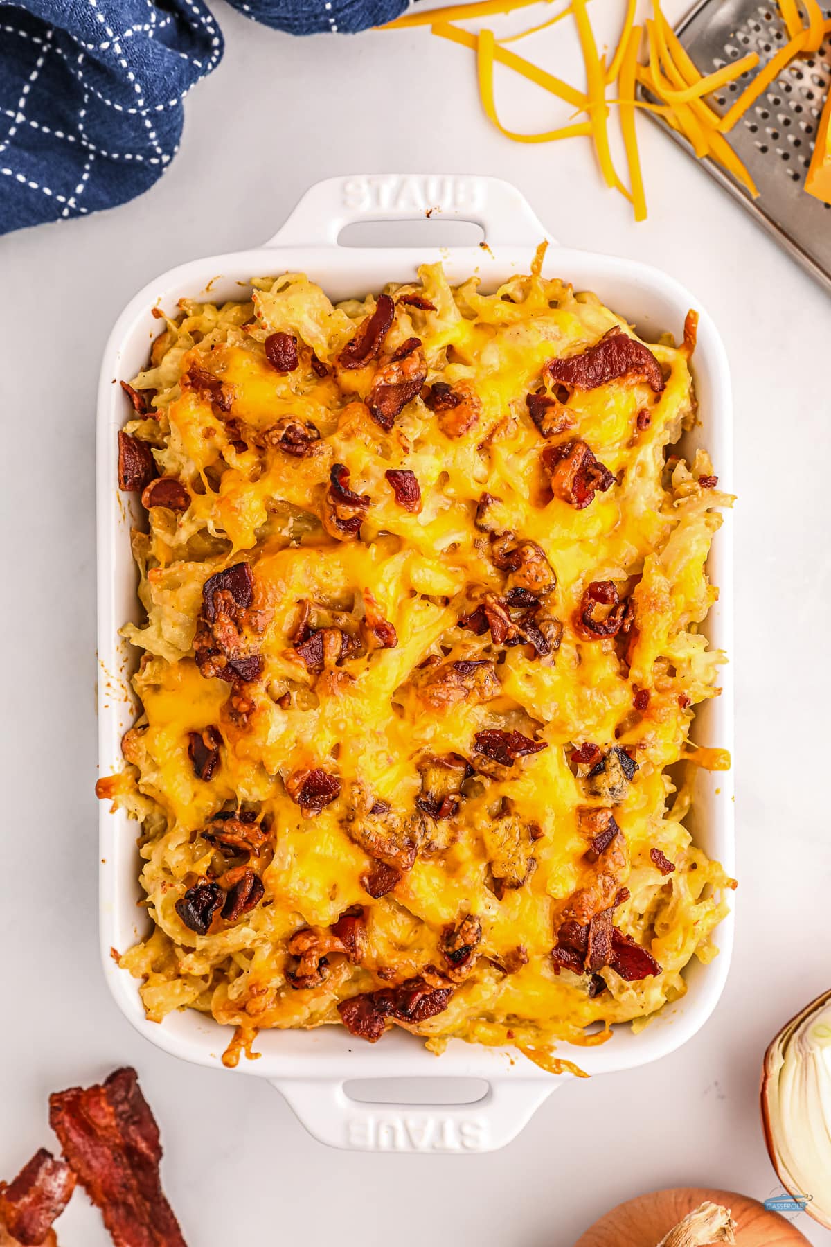 baked hashbrown casserole in a white dish