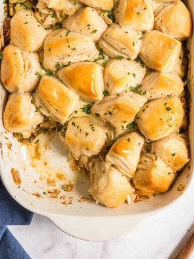 biscuit topped casserole in a white dish