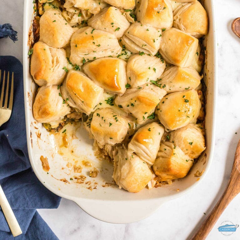 biscuit topped casserole in a white dish