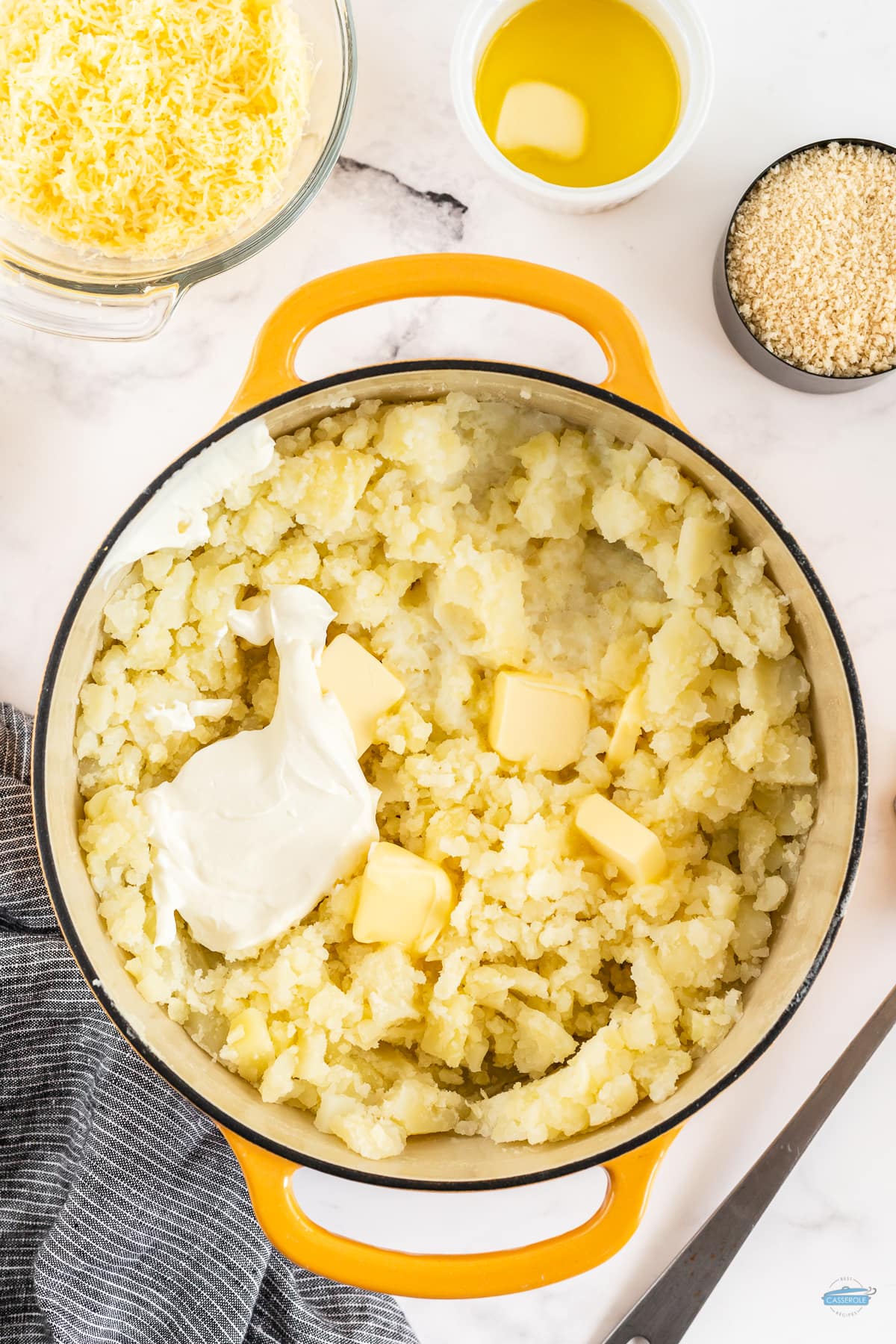 mashed potatoes in a pot with sour cream and butter