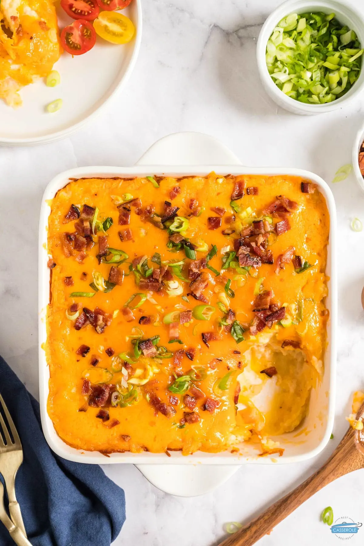 twice baked potato casserole with a scoop missing