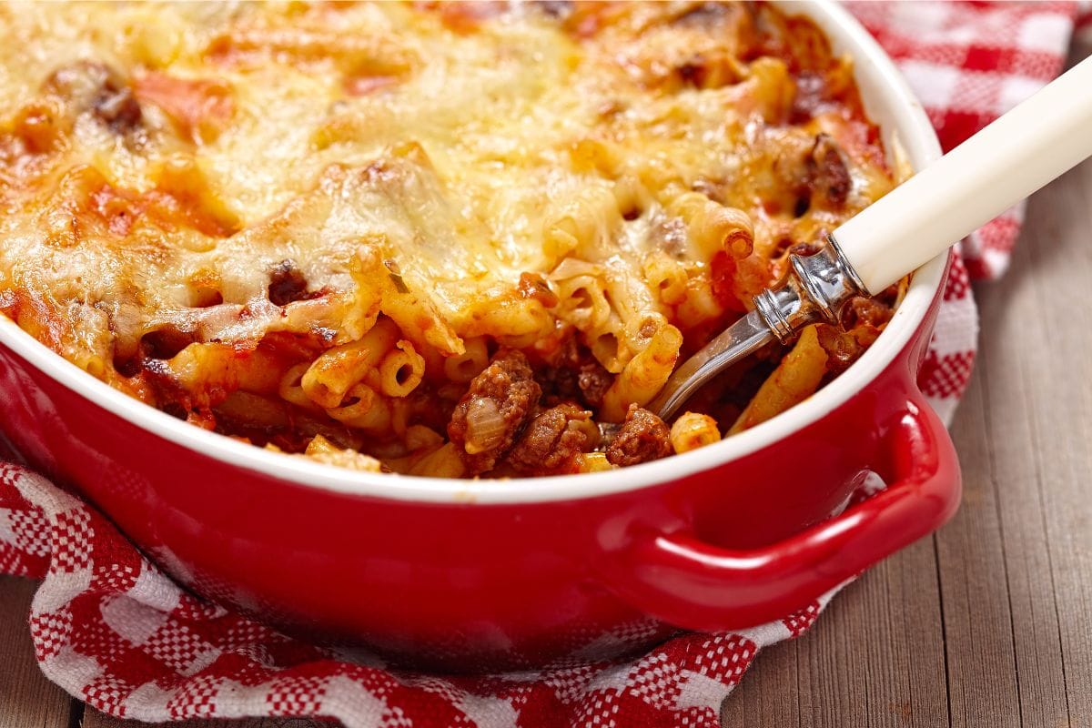 red hot dish with ziti and a spoon