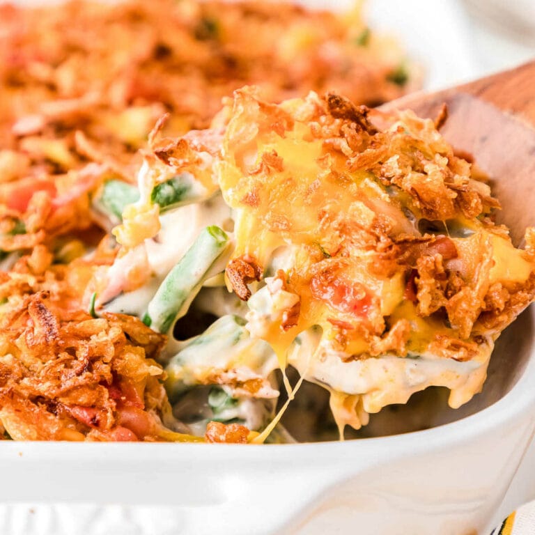 scoop of crack green bean casserole with spatula