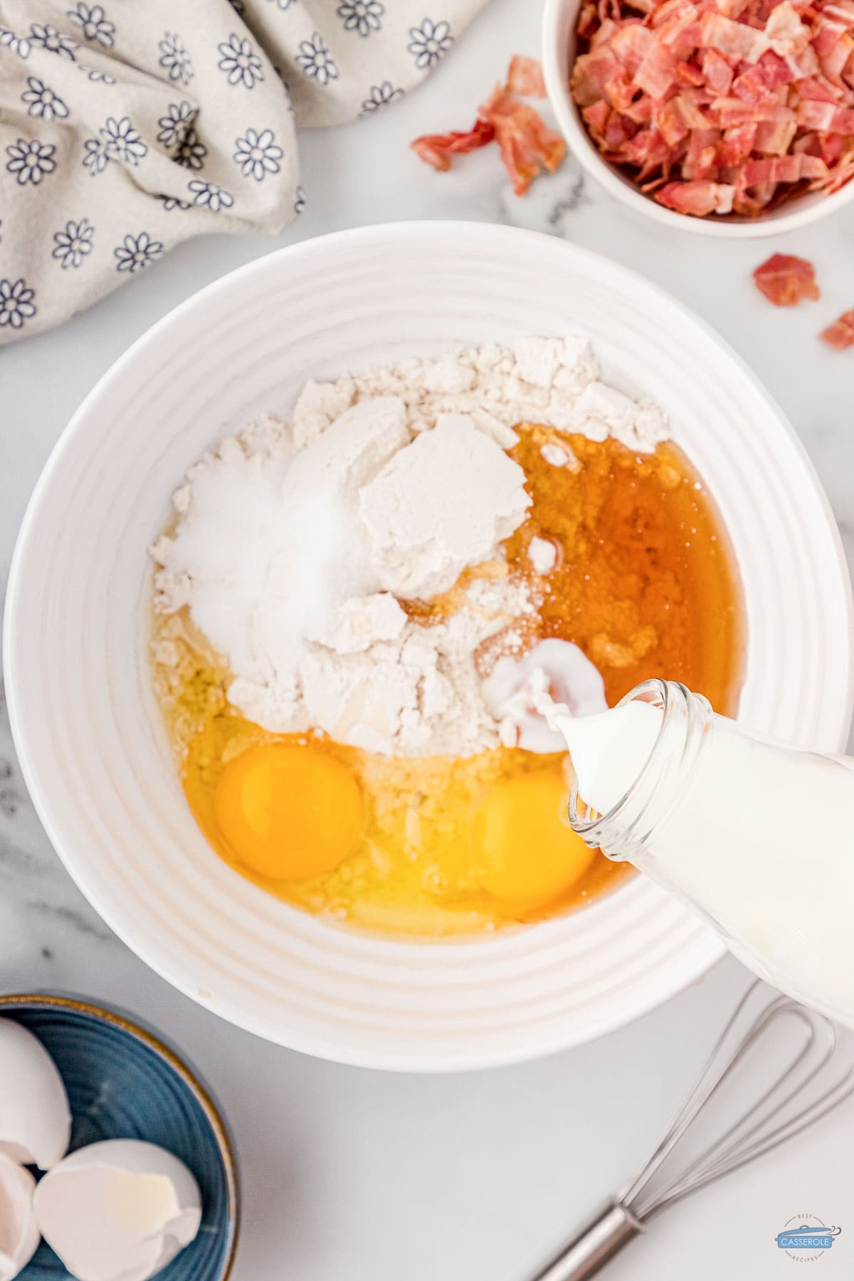 eggs, milk, and vanilla in a bowl