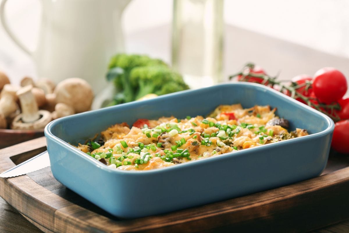 1 quart baking dish that's blue with tomatoes behind it
