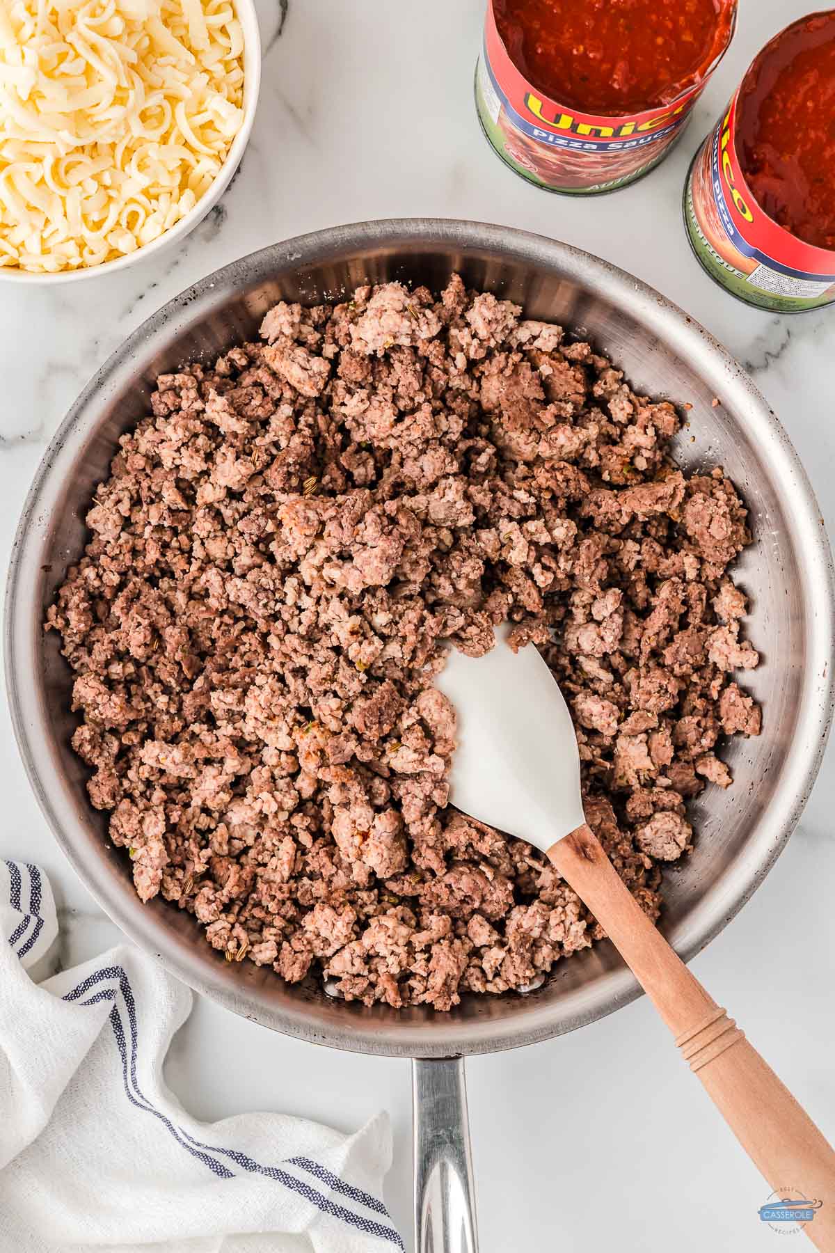 ground beef and sausage cooked in a skillet