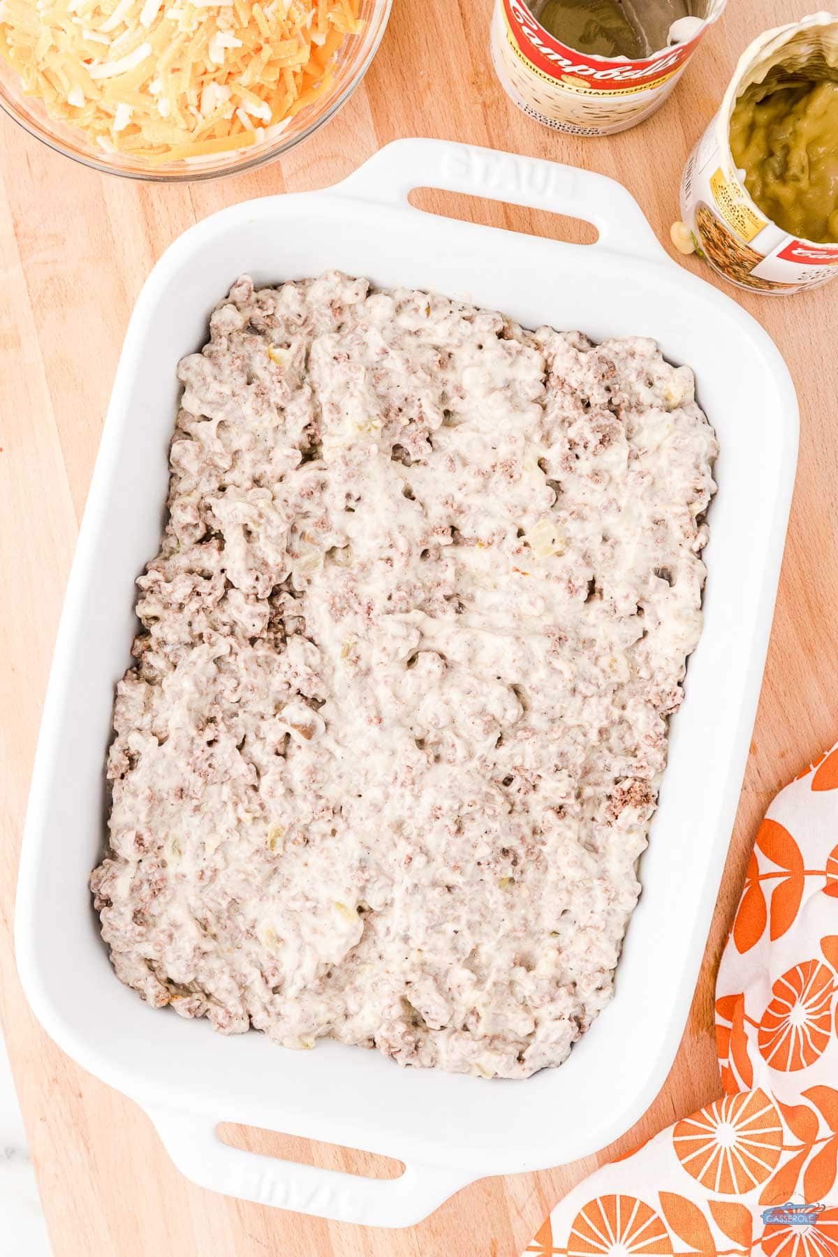 ground beef and soup in a white casserole dish