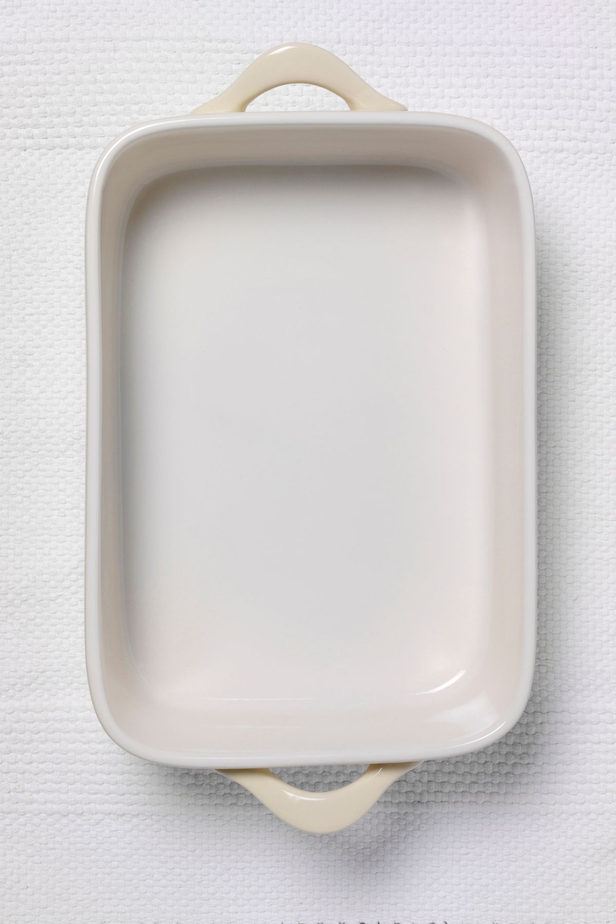 empty white 9x13 casserole dish with handles