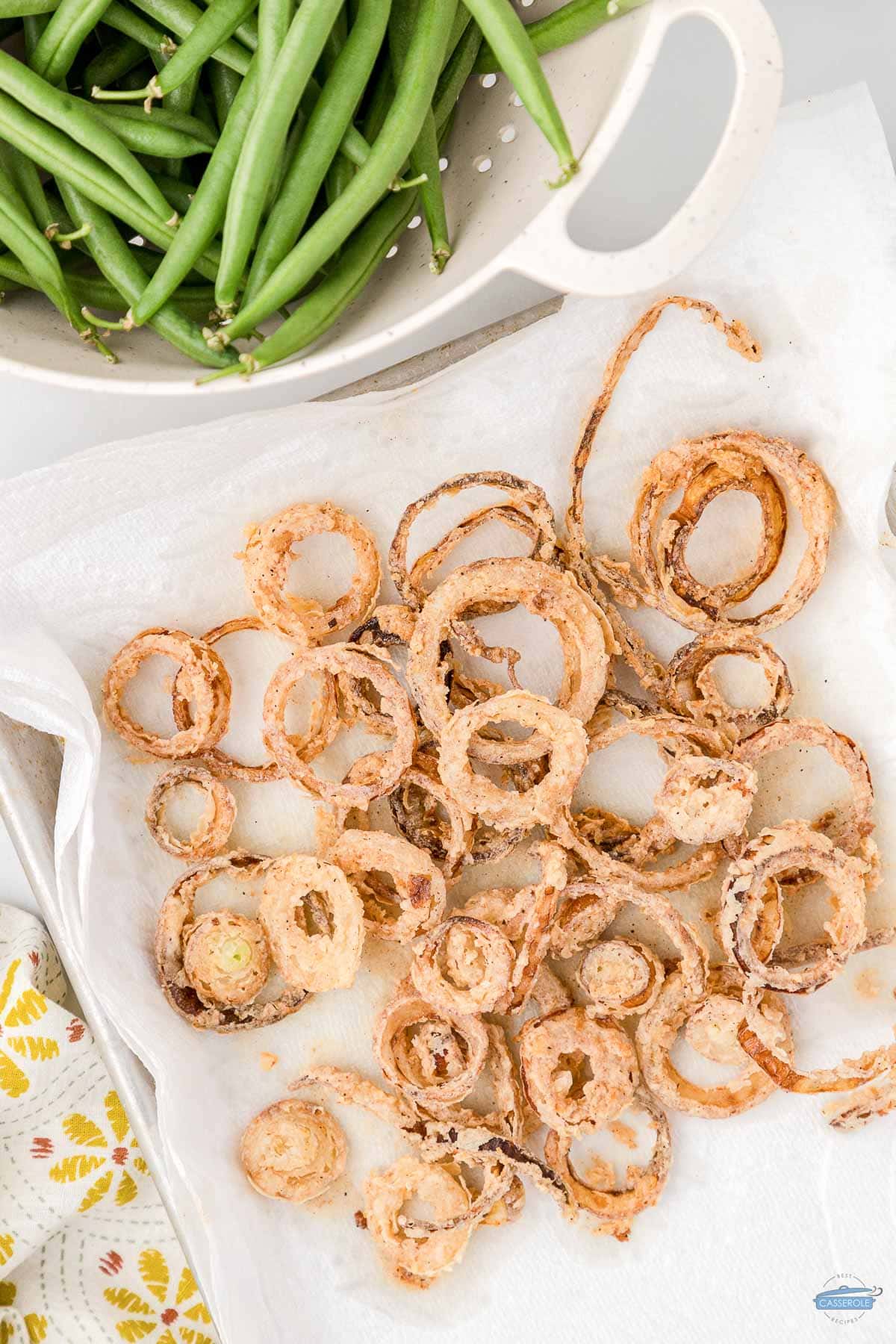 fried onion rings on paper towels