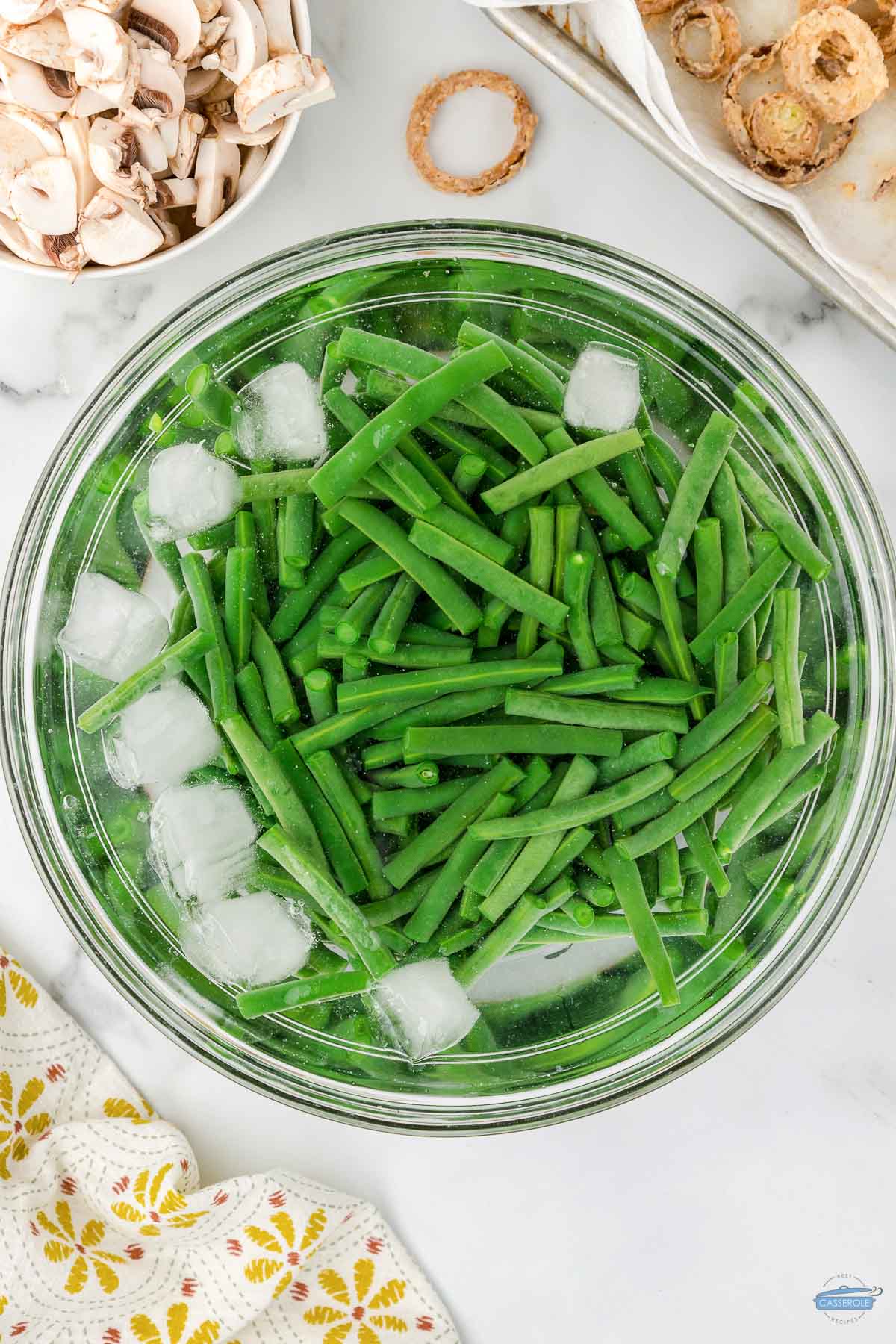 blanched green beans in an ice bath