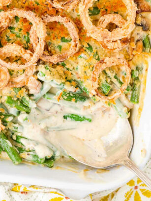 overhead picture of green bean casserole with spoon and scoop missing