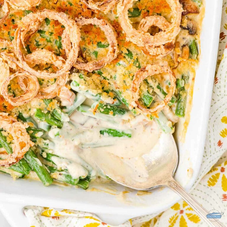 overhead picture of green bean casserole with spoon and scoop missing