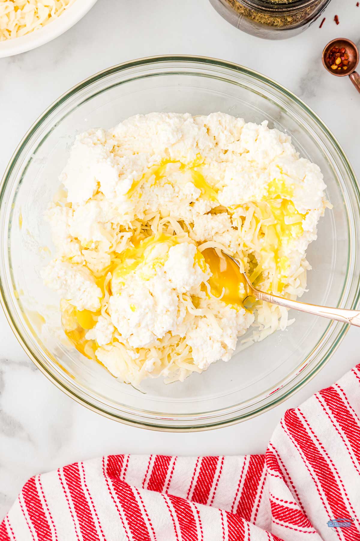 ricotta cheese and eggs in a clear bowl