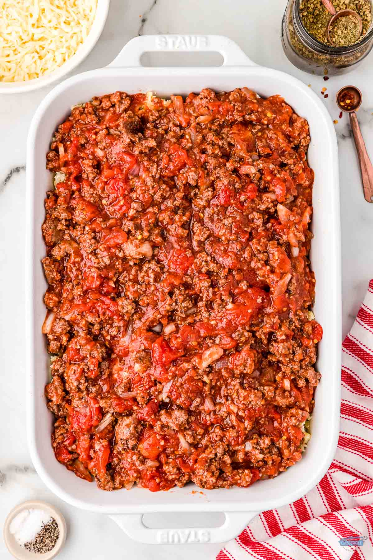 meat sauce in a white casserole dish