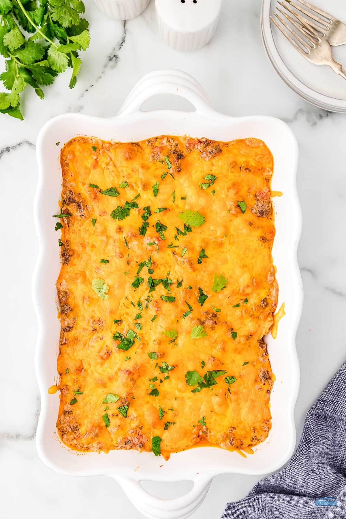 baked mexican trash casserole topped with melted cheese