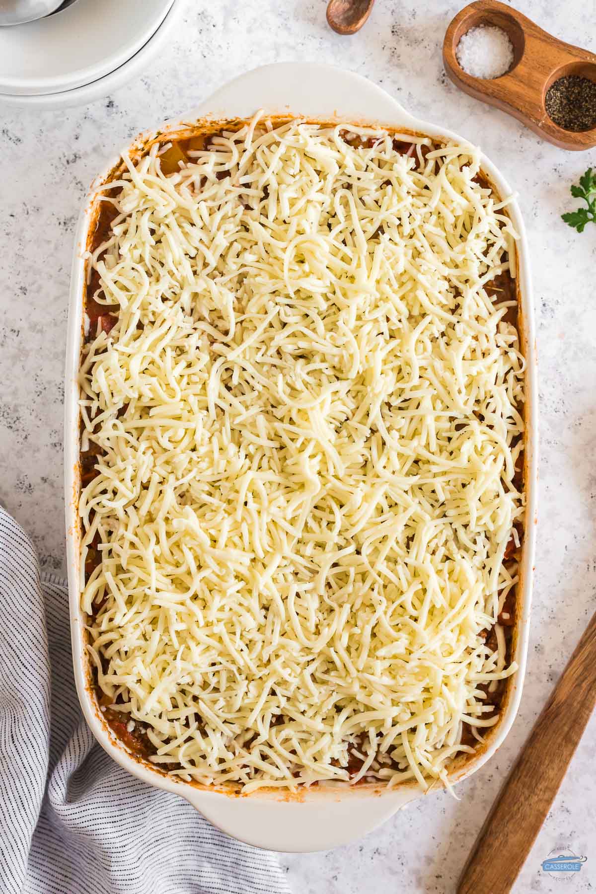 cheese on top of uncooked casserole