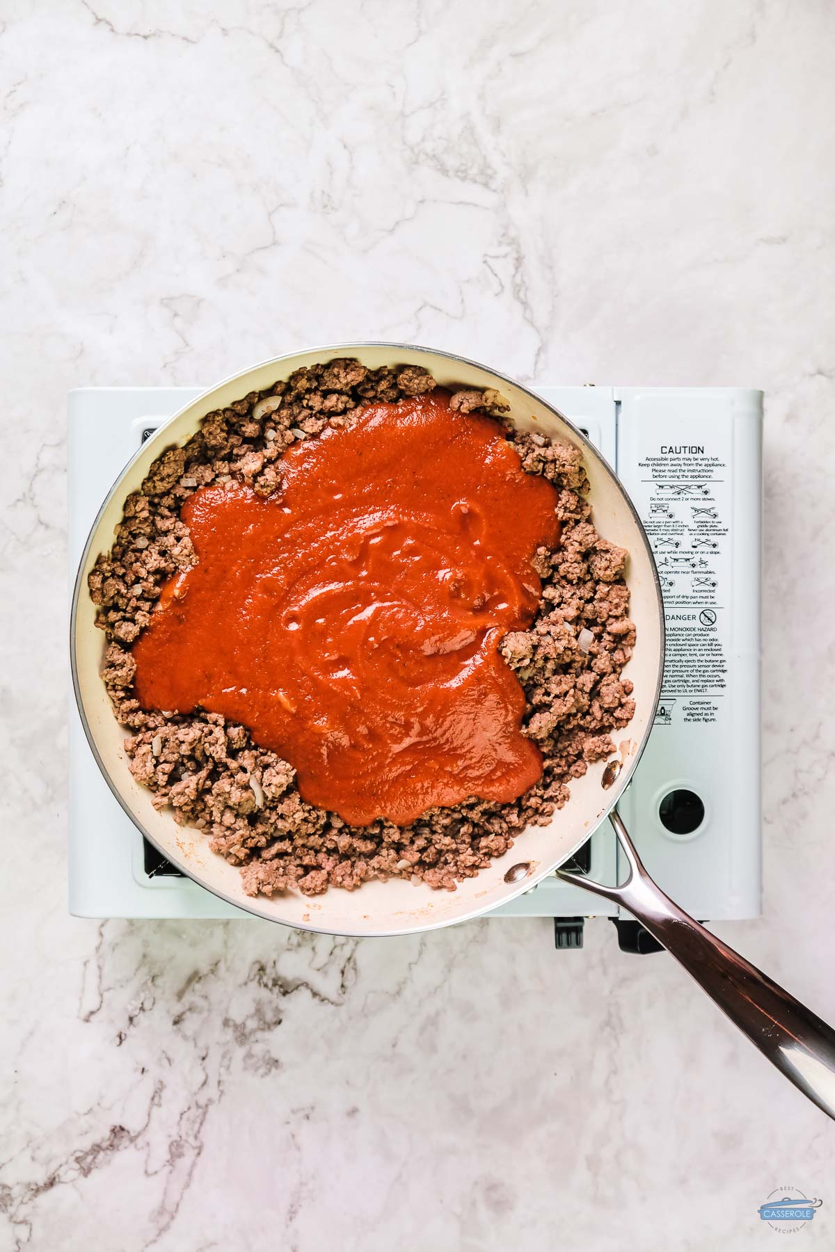 ground meat and tomato sauce in a skillet