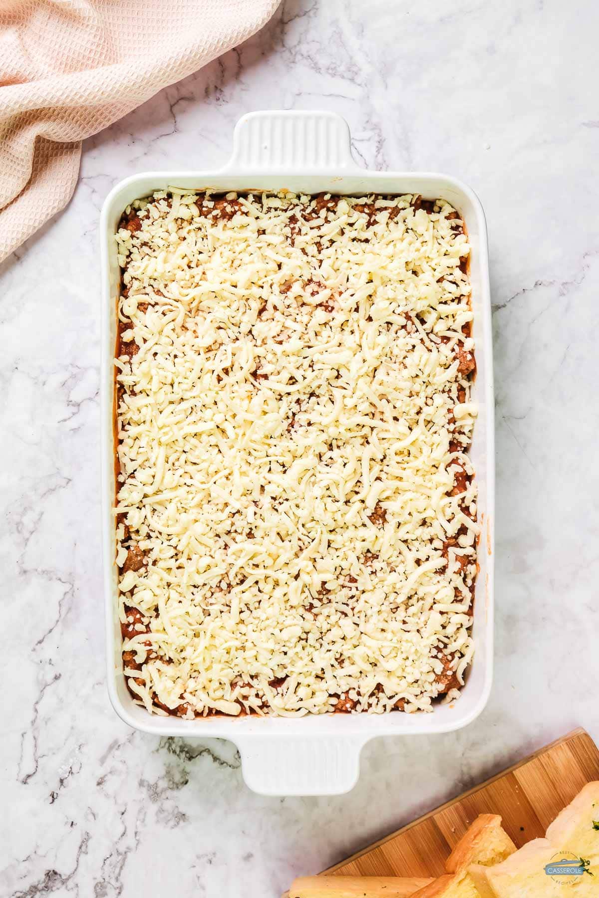 unbaked casserole in white dish