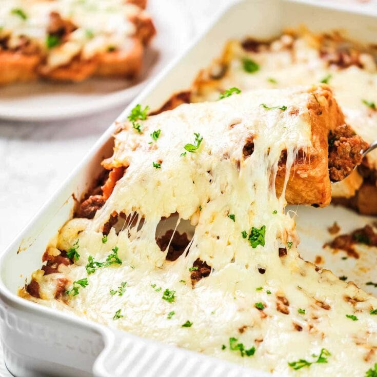 square of casserole with cheese and ground beef