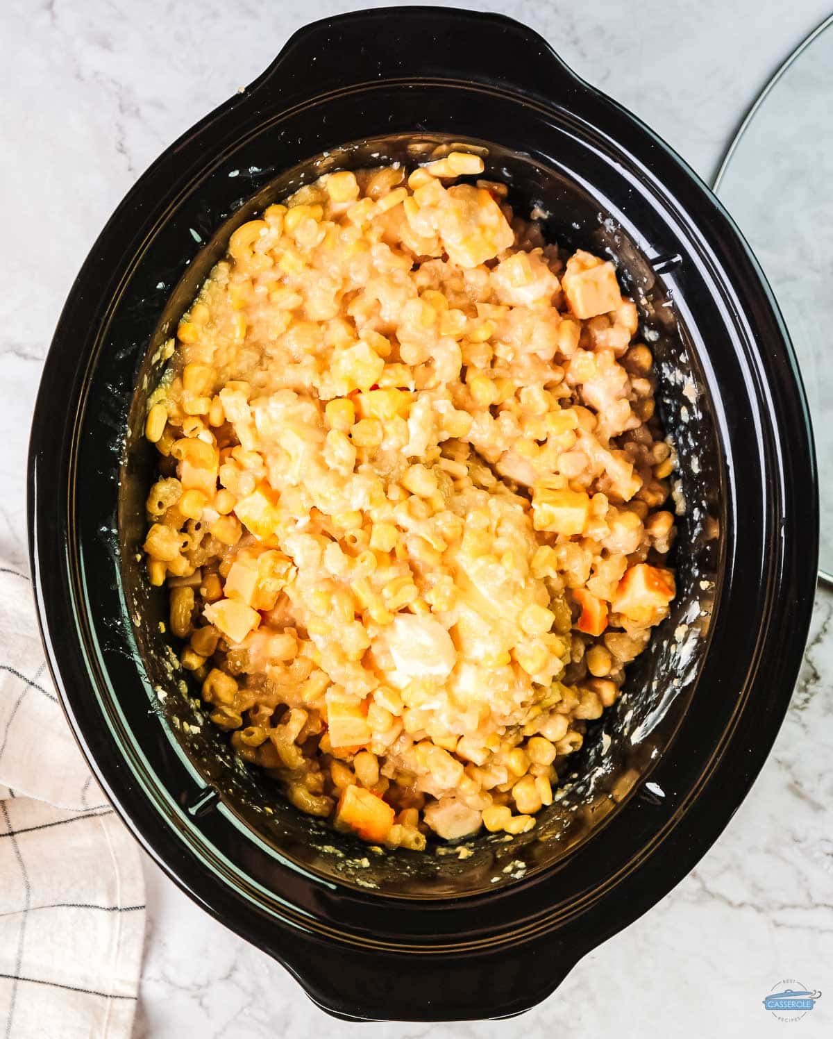 corn casserole in a black crock pot