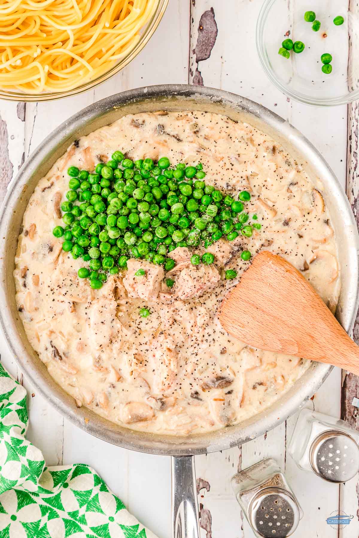 bite-size pieces of tuna and peas in a skillet