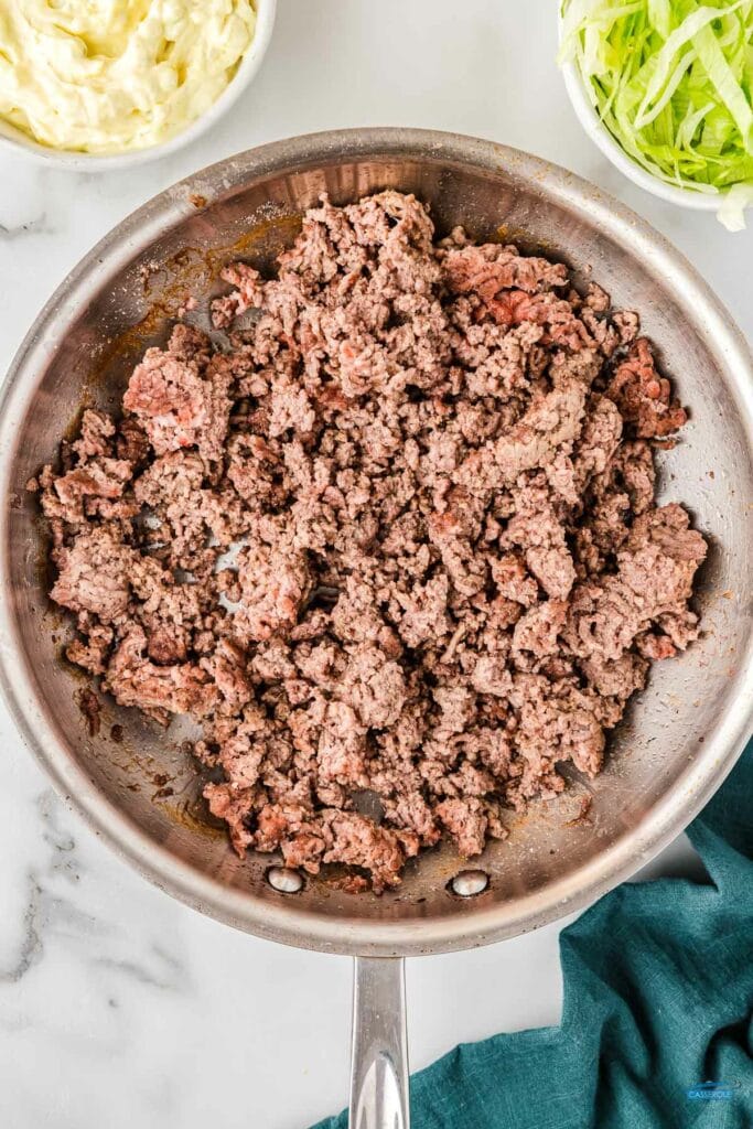 skillet with cooked ground beef