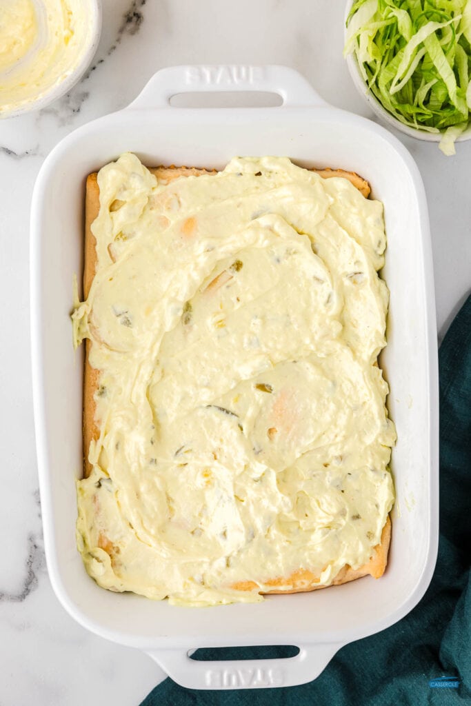 baked dough with a layer of tartar sauce