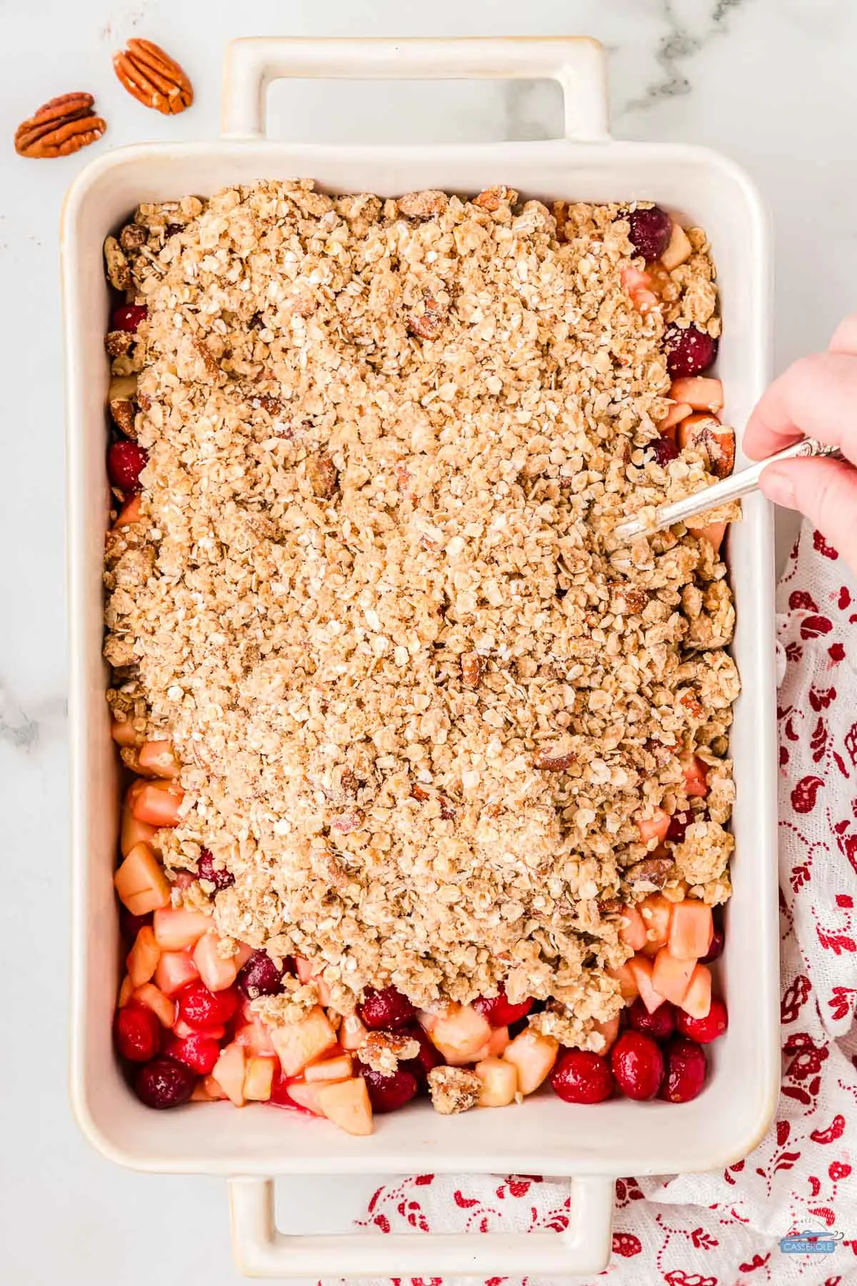 unbaked cranberry casserole in a white dish