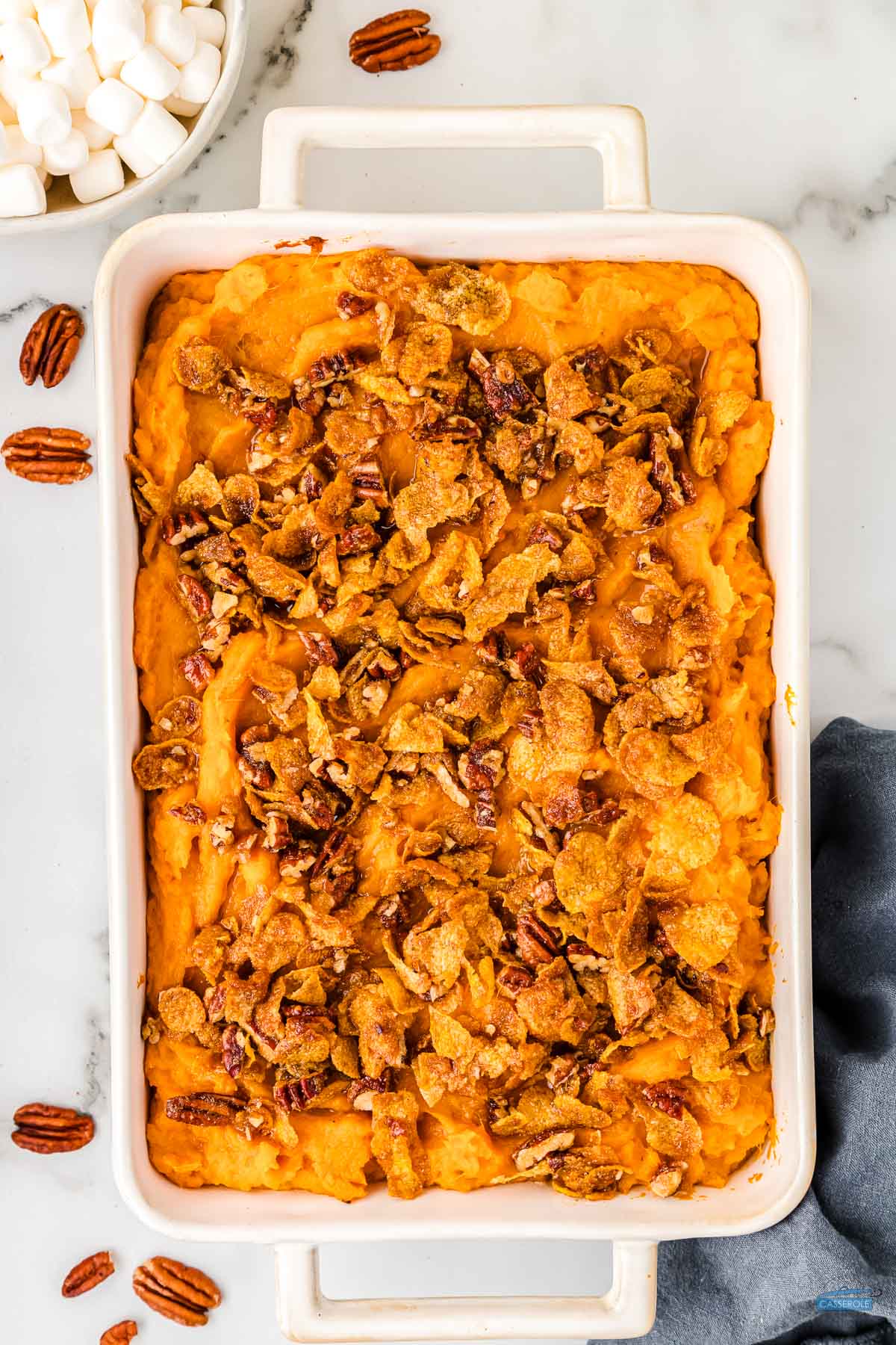 sweet potato casserole topped with the classic crumble of corn flakes and pecans