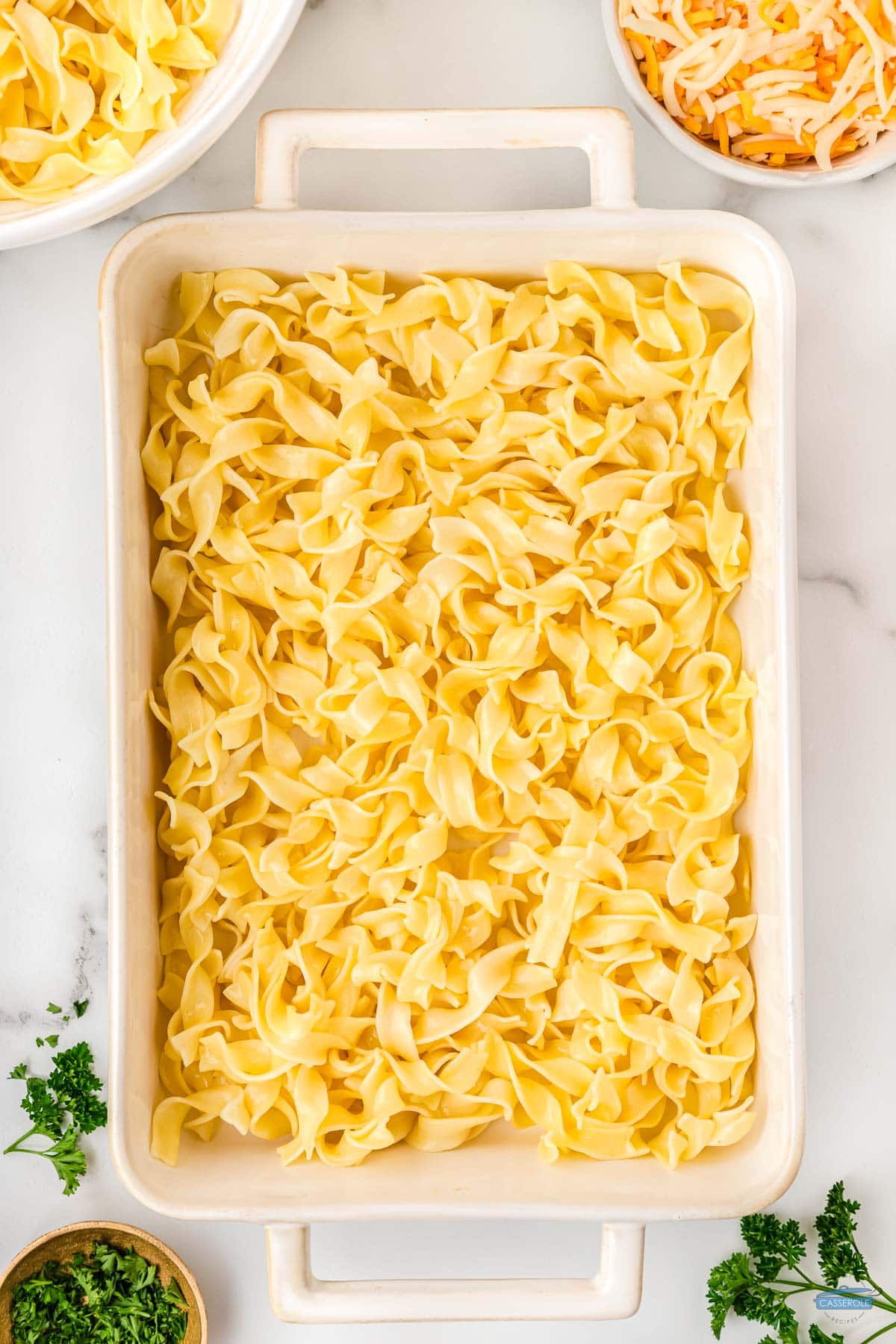 egg noodles in a casserole dish