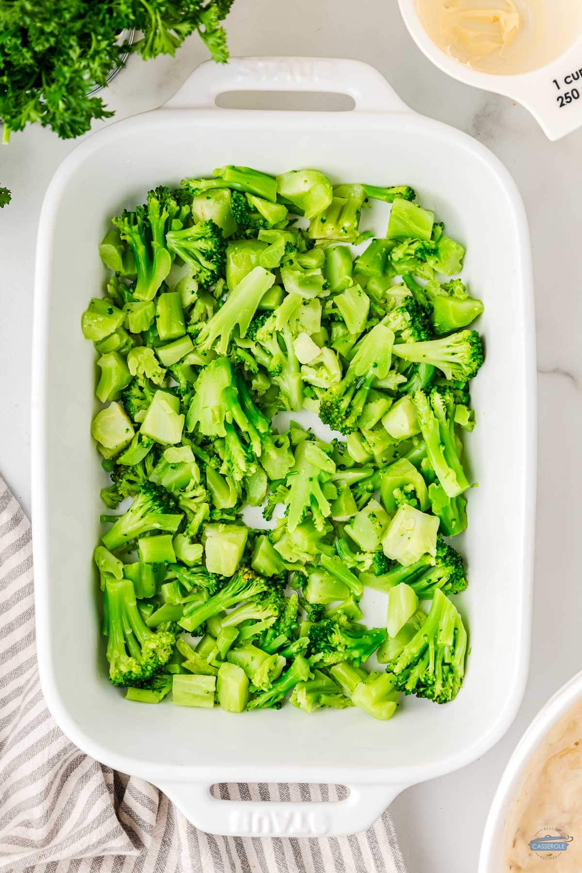 mix half-cooked broccoli in the bottom of casserole dish