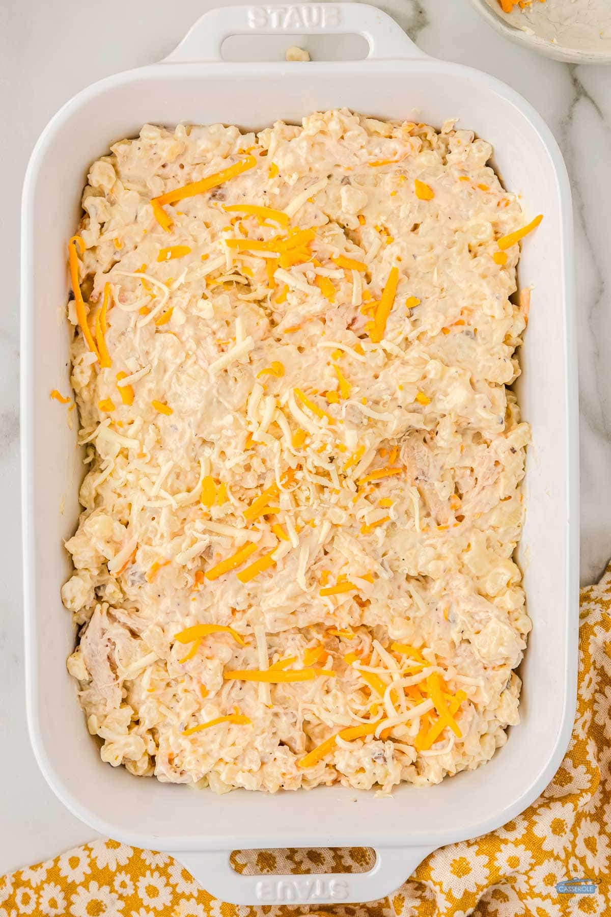 spread into baking dish and top with remaining shredded cheese