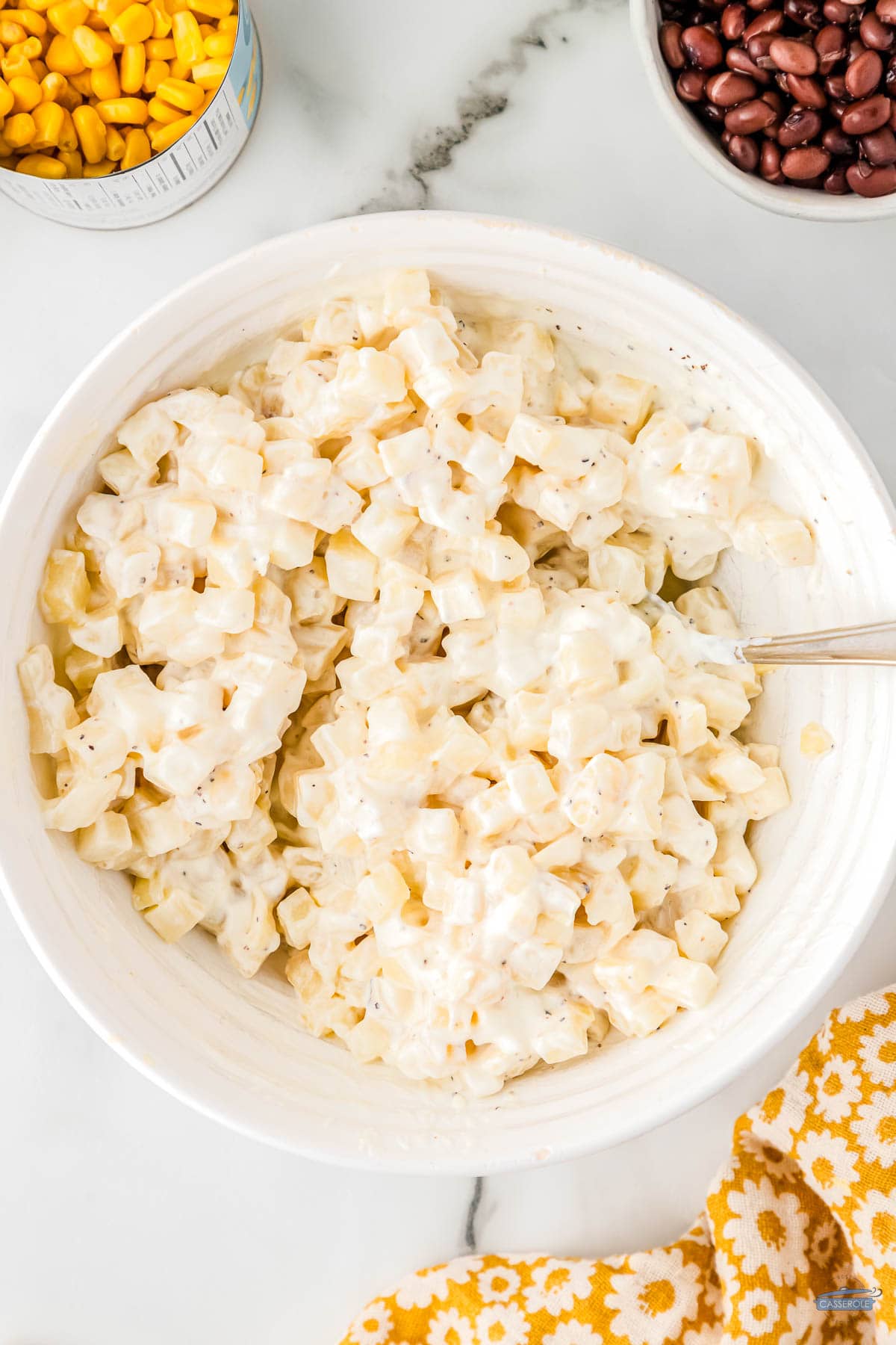 creamy corn and cheese in a bowl