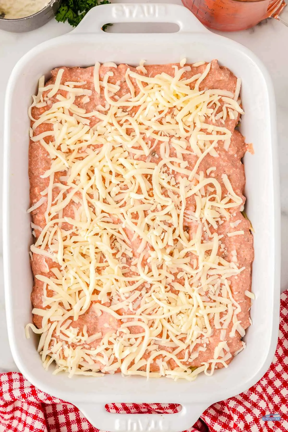 top with sauce and cheese