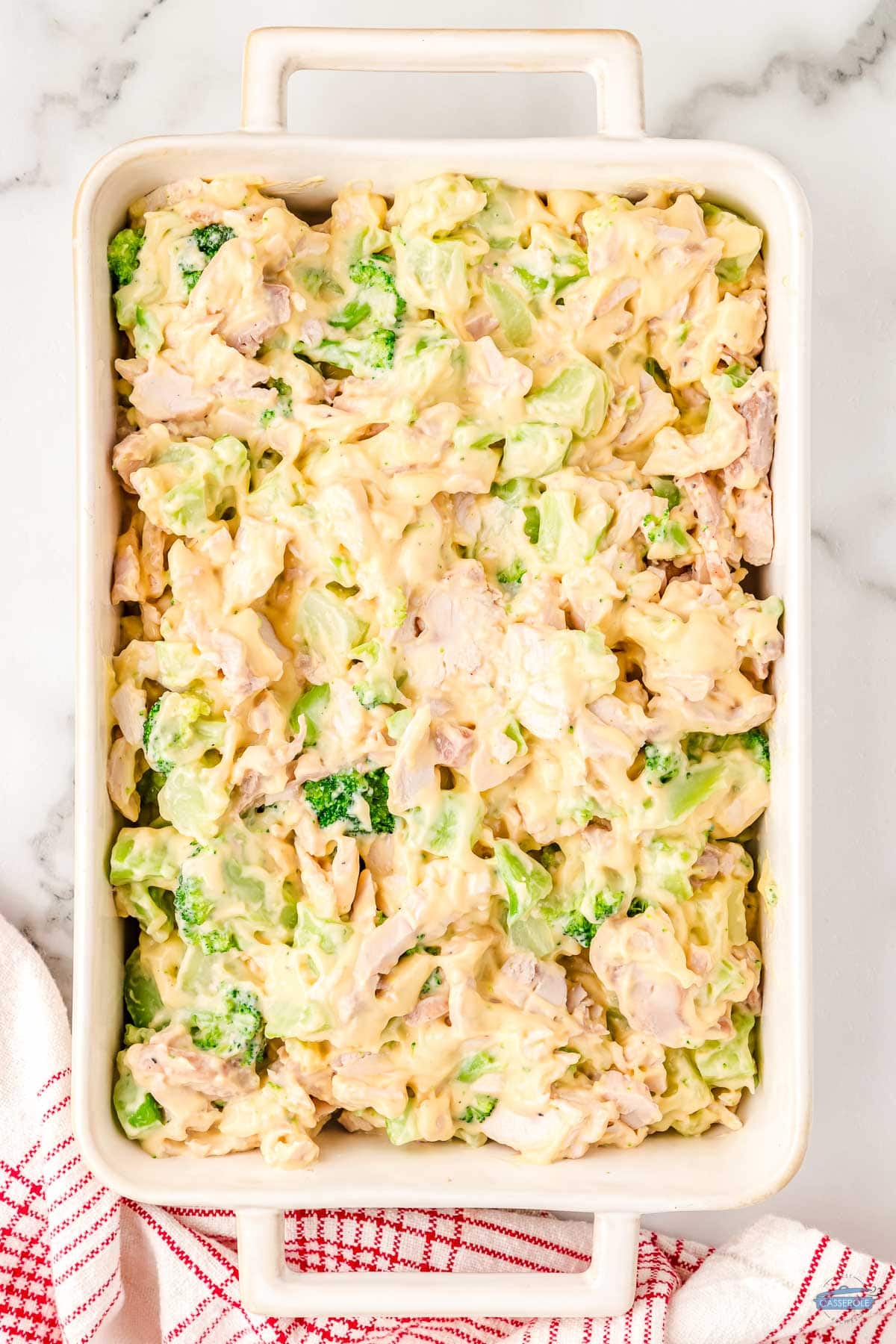 unbaked casserole in a white dish